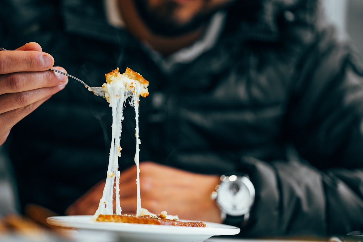 Active man preparing healthy meal with proteins and vegetables